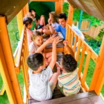 KidKraft Adventure Bend Two-Story Wood Swing Set with Clubhouse, Triple Slide, and Acrobar - Image 18