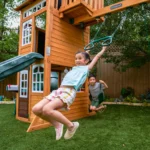 KidKraft Ridgemoor Perch Wood Swing Set with Playhouse, Rock Wall, and Tunnel Slide - Image 9