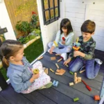 Wrangler Way Wooden Swing Set / Playset with Playhouse, 2 Slides and 3 Swings - Image 3